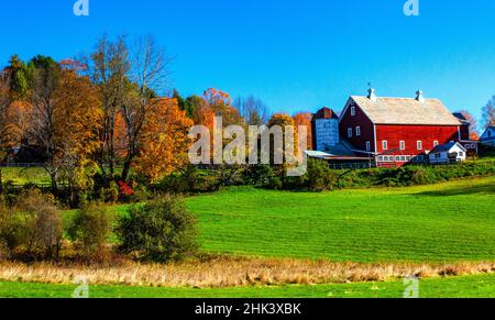 USA, New England, Vermont red barn in the countryside with Fall colors Stock Photo