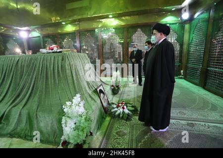 Tehran, Tehran, Iran. 2nd Feb, 2022. A handout picture provided by the Iranian president official website on February 2, 2022, shows Iran's president Ebrahim Raisi praying at the tomb inside the mausoleum of the late founder of the Islamic Republic, Ayatollah Ruhollah Khomeini, in southern Tehran, on the occasion of the 43rd anniversary of Khomeini's return from exile to Iran. Khamenei's predecessor returned to Iran in February 1979 after 14 years in political exile in Iraq and later France, following the revolution that led to the ouster of Iran's ruler at the time, Shah Mohammad Reza Pahl Stock Photo