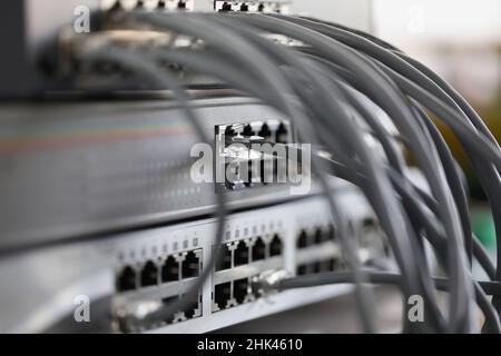 Optical mains cables connected to main server closeup Stock Photo