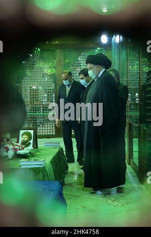 Tehran, Tehran, Iran. 2nd Feb, 2022. A handout picture provided by the Iranian president official website on February 2, 2022, shows Iran's president Ebrahim Raisi praying at the tomb inside the mausoleum of the late founder of the Islamic Republic, Ayatollah Ruhollah Khomeini, in southern Tehran, on the occasion of the 43rd anniversary of Khomeini's return from exile to Iran. Khamenei's predecessor returned to Iran in February 1979 after 14 years in political exile in Iraq and later France, following the revolution that led to the ouster of Iran's ruler at the time, Shah Mohammad Reza Pahl Stock Photo