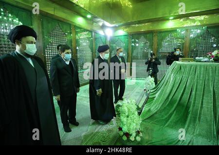 Tehran, Tehran, Iran. 2nd Feb, 2022. A handout picture provided by the Iranian president official website on February 2, 2022, shows Iran's president Ebrahim Raisi praying at the tomb inside the mausoleum of the late founder of the Islamic Republic, Ayatollah Ruhollah Khomeini, in southern Tehran, on the occasion of the 43rd anniversary of Khomeini's return from exile to Iran. Khamenei's predecessor returned to Iran in February 1979 after 14 years in political exile in Iraq and later France, following the revolution that led to the ouster of Iran's ruler at the time, Shah Mohammad Reza Pahl Stock Photo