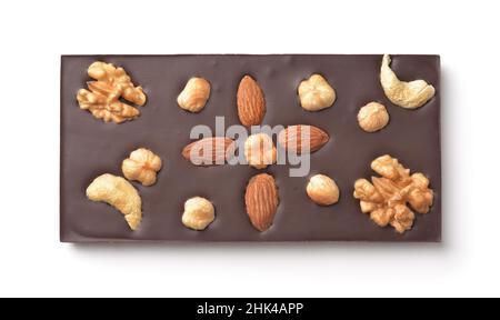 Top view of handmade chocolate bar with whole almond, hazelnut, walnut and cashew isolated on white Stock Photo