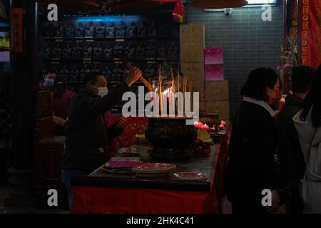 Hong Kong, China. 2nd Feb, 2022. Worshippers offer incense sticks at the local temple. Despite the fifth wave of Coronavirus continue spreading in Hong Kong, worshippers continued to visit temple during Lunar New Year. (Credit Image: © Keith Tsuji/ZUMA Press Wire) Stock Photo