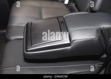 Luxury car rear seat cup holders with control panel Stock Photo