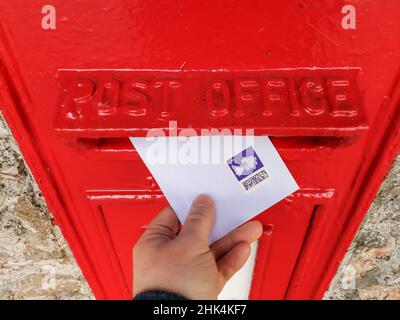 Torquay, UK. 02nd Feb, 2022. Posting a 1st class letter with the new QR Code Stamps from the Royal Mail, released 2nd Feb 2022 in the UK. Credit: Thomas Faull/Alamy Live News Stock Photo