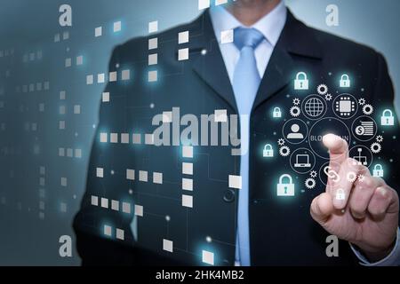 Blockchain technology network concept. Businessman working with microcircuit icon cryptocurrency and Stock Photo