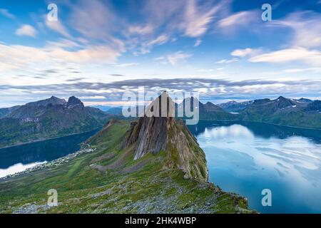 Clouds at sunset over the unspoiled blue water of fjords and Segla Mountain, Senja island, Troms county, Norway, Scandinavia, Europe Stock Photo