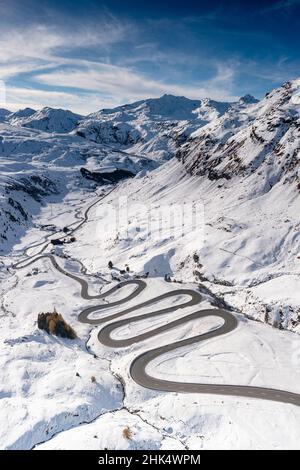 Aerial view of winding mountain road in the snow, Julier Pass, Albula district, Engadine, canton of Graubunden, Switzerland, Europe Stock Photo