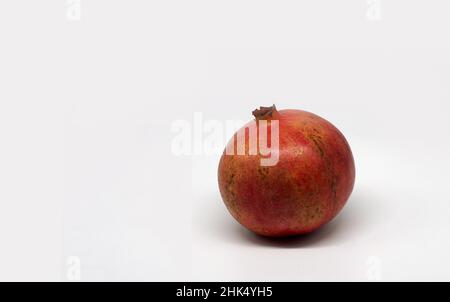 Red pomegranate isolated on white background Stock Photo