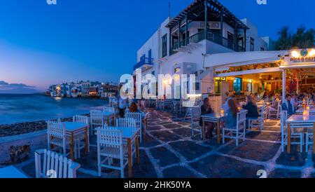 View of restaurants at Little Venice in Mykonos Town at night, Mykonos, Cyclades Islands, Greek Islands, Aegean Sea, Greece, Europe Stock Photo