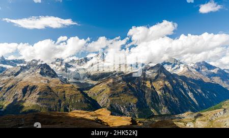Sun shining over the Zinalrothorn mountain peak through clouds, Valais Canton, Swiss Alps, Switzerland, Europe Stock Photo