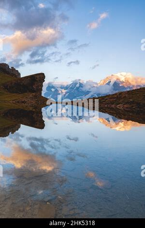 Sunset over Grauseeli Lake with Eiger, Monch and Jungfrau mountains in the background, Murren Birg, Bern canton, Switzerland, Europe Stock Photo