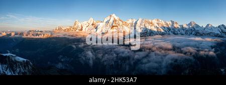 Foggy sky at sunset over majestic rocks of Eiger, Monch and Jungfrau mountains, Murren Birg, Jungfrau Region, Bern, Swiss Alps, Switzerland, Europe Stock Photo