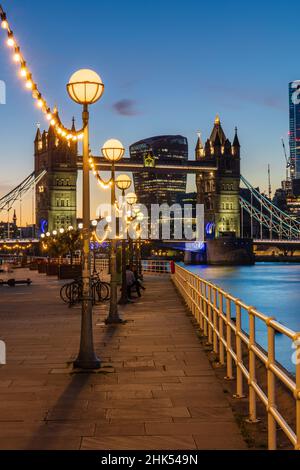 View of Tower Bridge and City of London at sunset, from Shad Thames, London, England, United Kingdom, Europe Stock Photo