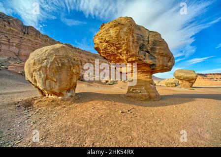 Balanced boulders at the base of Vermilion Cliffs in Glen Canyon Recreation Area, Arizona, United States of America, North America Stock Photo