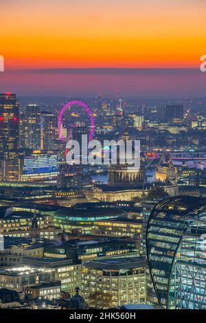 View of London Eye and St. Paul's Cathedral at dusk from the Principal Tower, London, England, United Kingdom, Europe Stock Photo