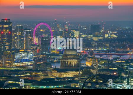 View of London Eye and St. Paul's Cathedral at dusk from the Principal Tower, London, England, United Kingdom, Europe Stock Photo