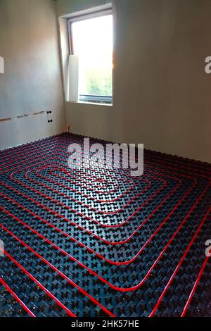 fllor heating in the house under construction with windows and light Stock Photo