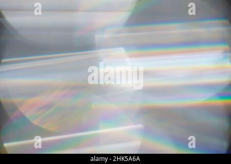 Rainbow Lens. Optical glare effect of objective lenses. Defocused blur reflection of rainbow sunbeams. Stock Photo