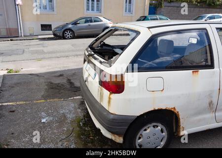 Broken car windscreen during a theft in a parking Stock Photo