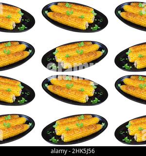 Golden, fried in oil and sprinkled with greens corn on the cob lies on a cast-iron frying pan. Seamless pattern on white background, isolated Stock Photo