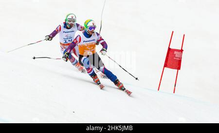 Radomir DUDAS of Slovakia follows the shouts of his guide in the Mens  Alpine Skiing Giant Slalom during the 2014 Winter Paralympic Games at the  Rosa K Stock Photo - Alamy