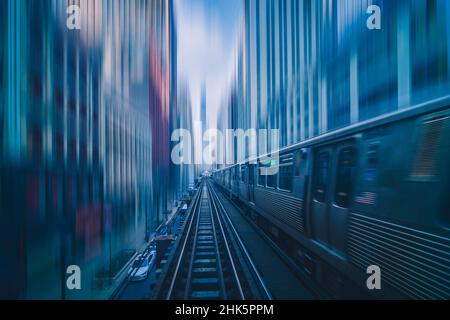 Futuristic scene Motion blur movement between elevated train line over the railroad tracks with building at the Loop line at Chicago, Illinois, USA, i Stock Photo