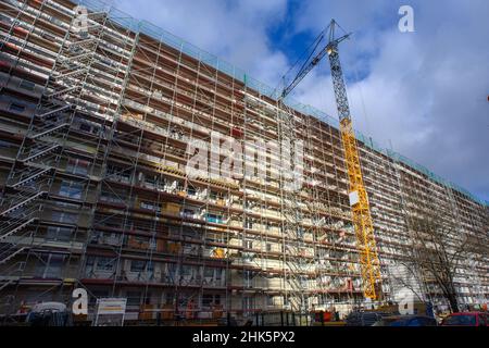 Magdeburg, Germany. 02nd Feb, 2022. A high-rise residential building enclosed by scaffolding in the north of Saxony-Anhalt's state capital. Housing shortages and affordable housing are not a major problem in Saxony-Anhalt, according to the state government. Credit: Klaus-Dietmar Gabbert/dpa-Zentralbild/ZB/dpa/Alamy Live News Stock Photo