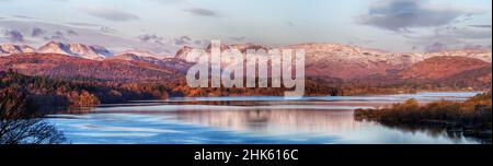 Windermere, the Langdale Pikes and surrounding hills at Sunrise in the English Lake District National Park Stock Photo