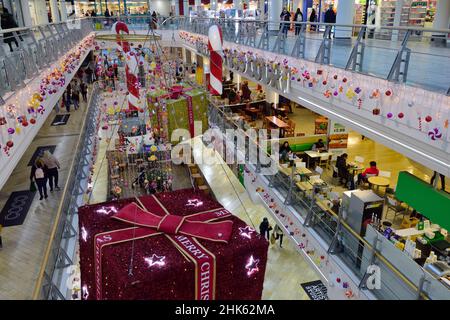 Christmas decorations and lights in shopping centre, UK Stock Photo