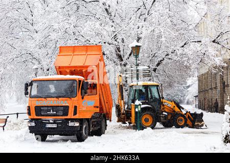 UZHHOROD, UKRAINE - FEBRUARY 2, 2022 - Municipal services remove the snow from the streets in winter, Uzhhorod, Zakarpattia Region, western Ukraine. Stock Photo