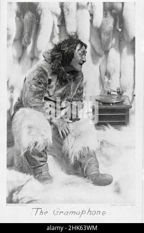 Robert J Flaherty photograph entitled The Gramophone - Elderly Inuit gentleman much enjoying listening to old style gramophone - 1922 Stock Photo