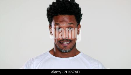 African man feeling surprised, expressive portrait showing angst emotion Stock Photo