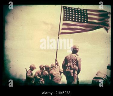 February 23, 1945, Iwo Jima - A still from the film shot by Marine photographer Bill Genaust of the flag-raising atop Mt. Suribachi. Stock Photo