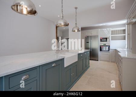 Sible Hedingham, Essex - May 10 2017: Kitchen area in period style within refitted and restored 16th century home with range of units including penins Stock Photo