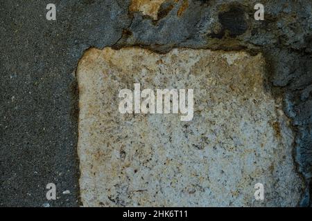 Yellow stone and cement wall texture. Stone and cement wall background. Stock Photo