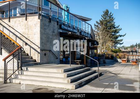 Friday Harbor, WA USA - circa November 2021: Angled view of the whale watching tours building on San Juan Island on a bright, sunny day. Stock Photo
