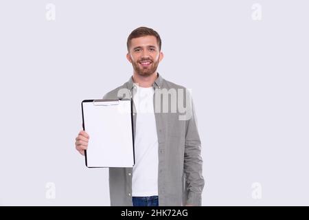Office Man Showing Blank Clipboard Isolated. Advertisment, Office, Commercial Concept. Office Worker Stock Photo