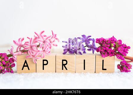 April word written on wood block. Stock Photo