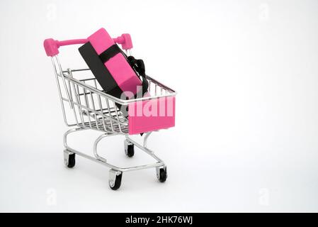 pink shopping cart with gift Stock Photo
