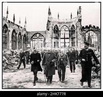 Winston Churchill visits Coventry Cathedral British Prime Minister grim faced visits Coventry Cathedral severley damaged by Nazi Germany Luftwaffe terror bombing Coventry UK 28th September 1941.  Prime Minister Winston Churchill walks with the Mayor of Coventry and a member of the Church of England clergy through the ruined nave of Coventry Cathedral after it was bombed by the German air force in November 1940. Official war photograph for the UK government. Stock Photo