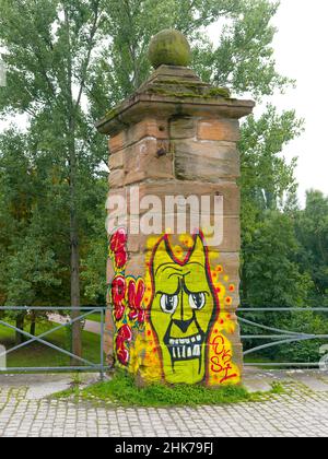 Graffiti on a stone column, Weimar, Thuringia, Germany Stock Photo