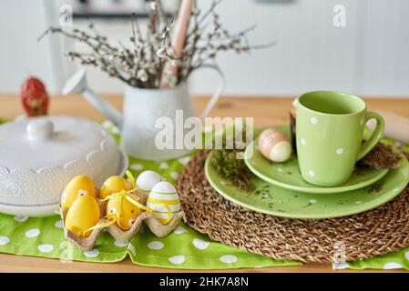 yellow Easter eggs on the table in the kitchen for decoration. Stock Photo