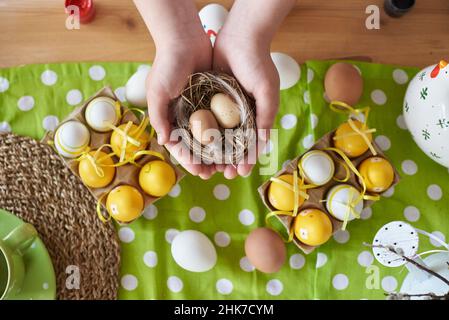 Two eggs for the holiday of easter in the hands of a child. Stock Photo