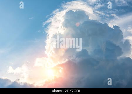 Bright sun shines through the storm clouds Stock Photo