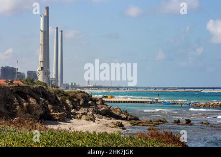 The towering smokestacks of the coal-fired Orot Rabin Power Plant along the Mediterranean Sea in Hadera, Israel. Stock Photo