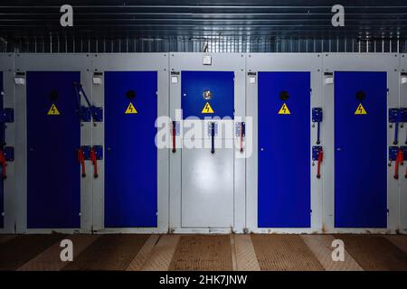 Transformer box. Locked metal doors of switchgear cabinets. Stock Photo