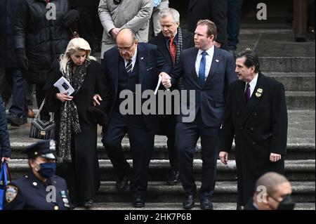 Former New York City Mayor Rudy Giuliani (second from left) and his son Andrew Giulliani (second from right), are seen descending the steps of St. Patrick's Cathedral after attending funeral services for fallen NYPD Officer Wilbert Mora, New York, NY, February 2, 2022. Thousands of NYPD officers converged on New York City's St. Patrick's Cathedral for the second time in a week to pay tribute to a fallen young officer; Mora was shot along with Officer Jason Rivera on Jan. 21 while responding to a call about a domestic argument. (Photo by Anthony Behar/Sipa USA) Stock Photo