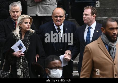 Former New York City Mayor Rudy Giuliani (second from left) and his son Andrew Giulliani (second from right), are seen descending the steps of St. Patrick's Cathedral after attending funeral services for fallen NYPD Officer Wilbert Mora, New York, NY, February 2, 2022. Thousands of NYPD officers converged on New York City's St. Patrick's Cathedral for the second time in a week to pay tribute to a fallen young officer; Mora was shot along with Officer Jason Rivera on Jan. 21 while responding to a call about a domestic argument. (Photo by Anthony Behar/Sipa USA) Stock Photo