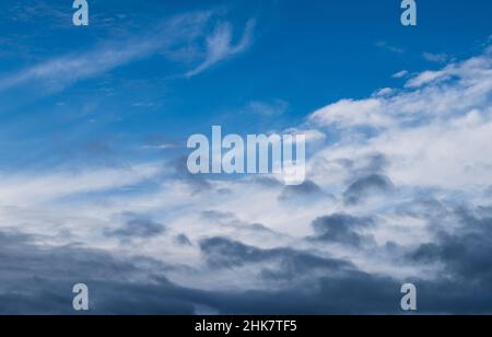 Blue sky shrouded in gray dark clouds Stock Photo